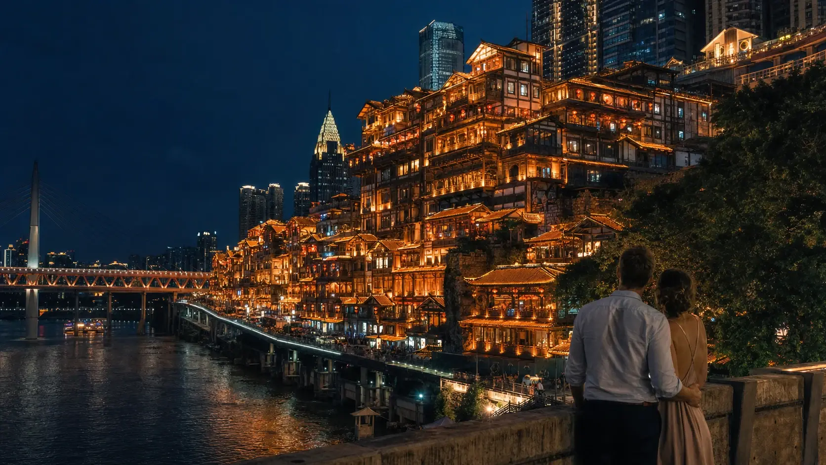 The stacked stilt-houses of Hongyadong, Chongqing, glowing at night above the river